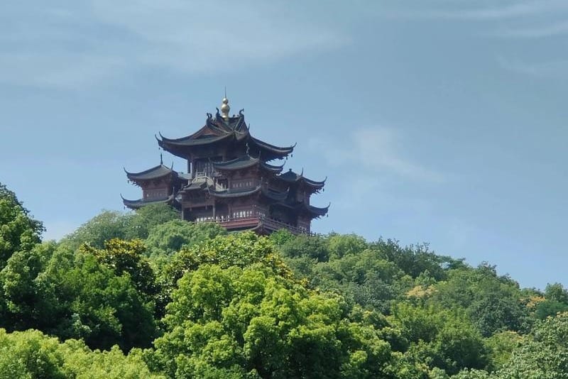 Chenghuang Pavilion on Wushan summit with panoramic West Lake view in the background